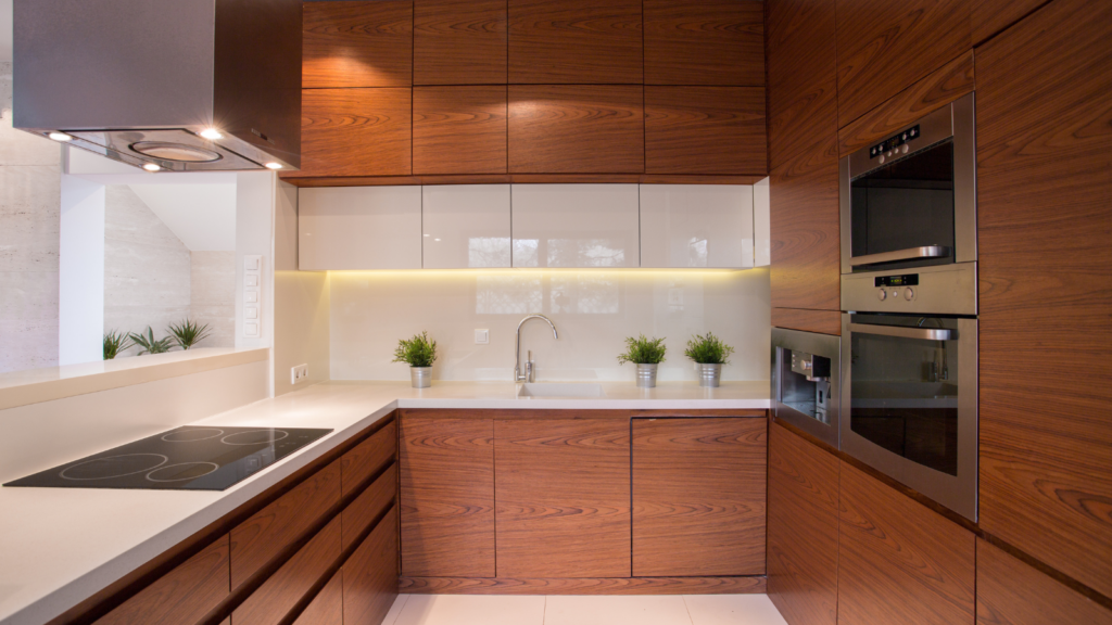 Two-tone kitchen cabinets featuring natural wood grain and sleek white uppers by Southern Cabinets.
